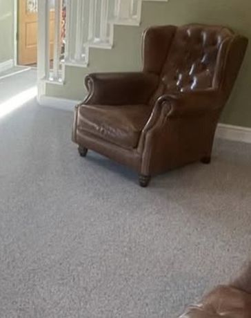 Grey wool carpet fitted in a sitting room