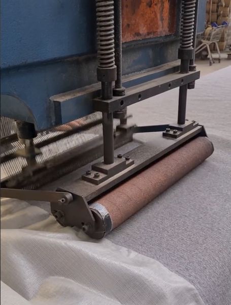 Carpet being finished on machinery at the Howkel mill