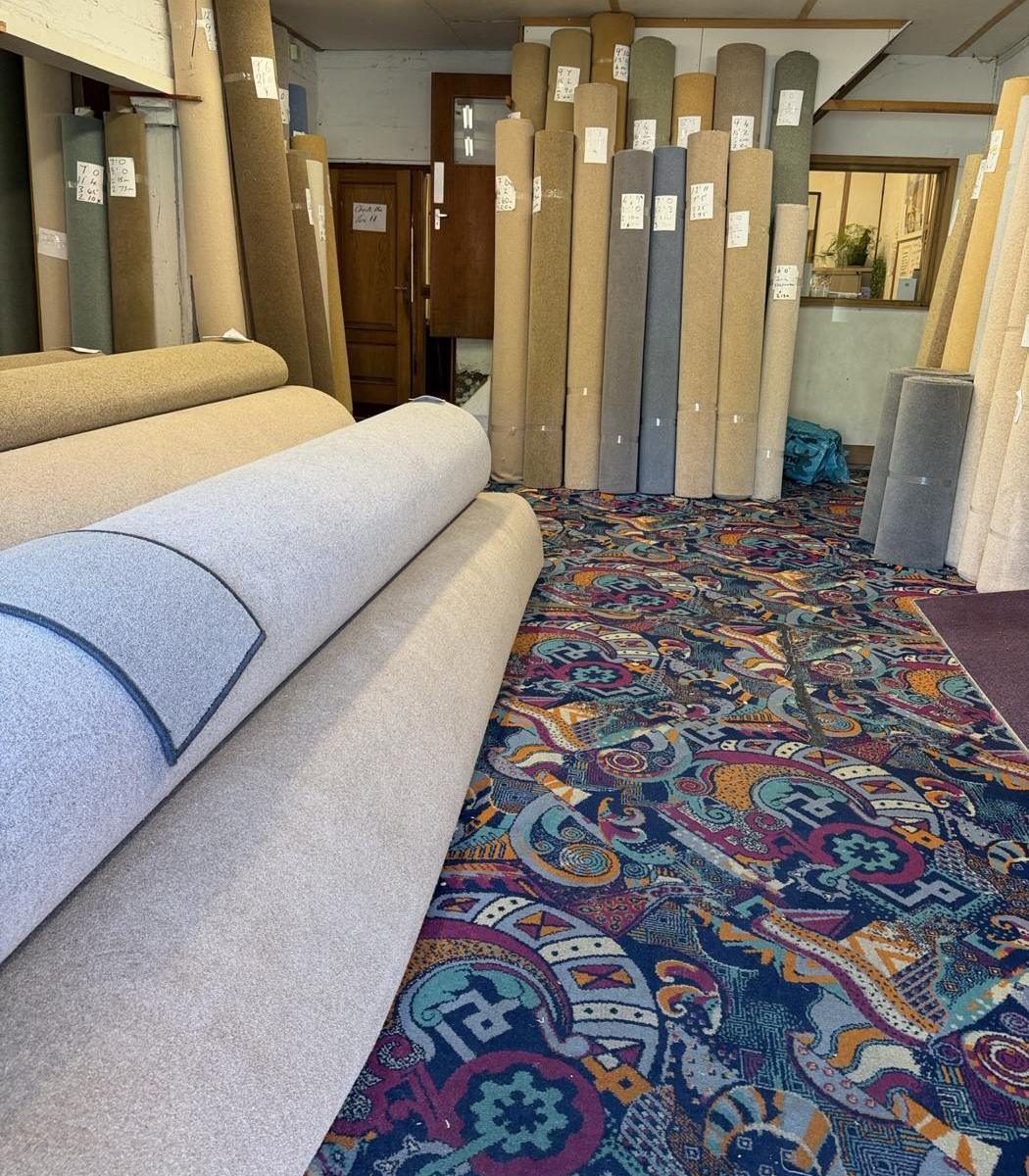 Carpet remnants stood on end, ready to go