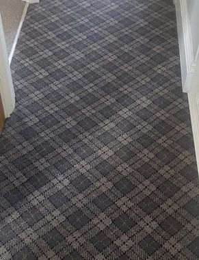 Tartan carpet fitted on a landing